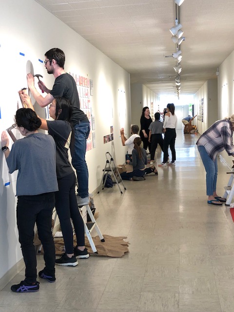 Artists installing their works