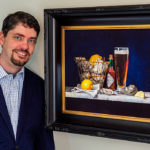 Artist Spotlight: Matthew Bird Artist posing with his still life painting