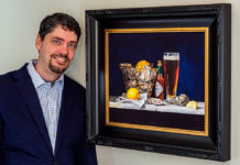 Artist Spotlight: Matthew Bird Artist posing with his still life painting