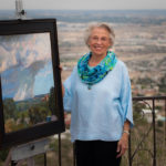 Artist Spotlight: Nina Cobb Walker Woman artist standing next to one of her paintings