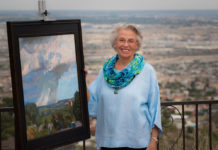 Artist Spotlight: Nina Cobb Walker Woman artist standing next to one of her paintings