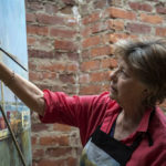 Artist Spotlight: Nancy Tankersley Female artist painting.