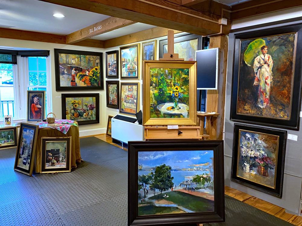 Artist's studio with paintings hanging on the walls