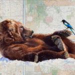 Artist Spotlight: Lisa Gleim Pastel painting of a reclining bear with a magpie on its paw, painted on a state and national park map