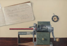 Featured Artwork: Betsy Kellum Oil painting of a pencil in an old-fashioned sharpener with a cursive writing sample on the wall