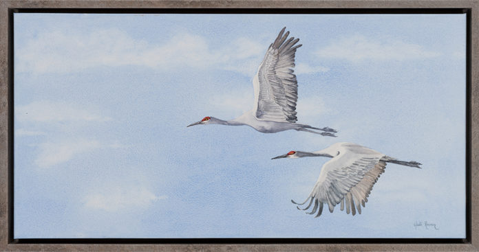 Watercolor painting of two geese flying