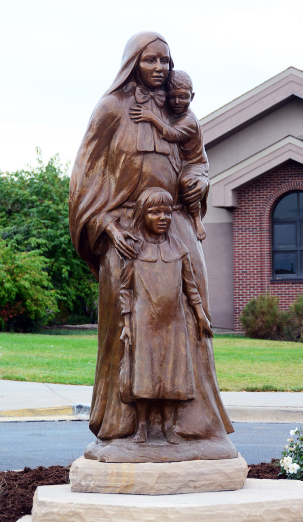 Large sculpture of a woman and children