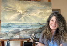 Artist Spotlight: Karen Ann Hitt Female artist in front of one of her oil paintings