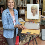 Artist Spotlight: Johanne Mangi artist johanne mangi smiling with her artwork, in studio