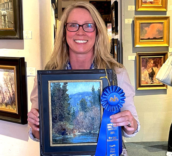 artist Kim Casebeer with her wet paint competition painting at the American Impressionist Society Show