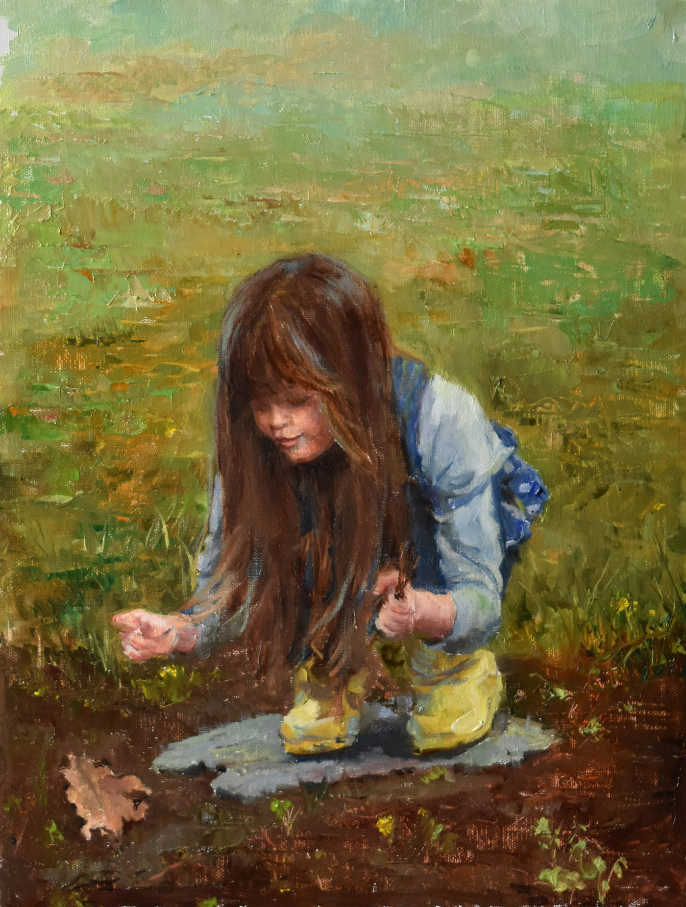 young child picking flowers from a garden