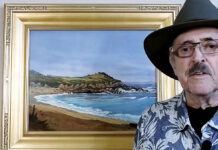 Artist Spotlight: Larry Cannon artist standing for a picture with his painting