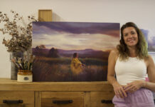 Artist Spotlight: Jessica Le Clerc Artist posing for a photo next to her painting