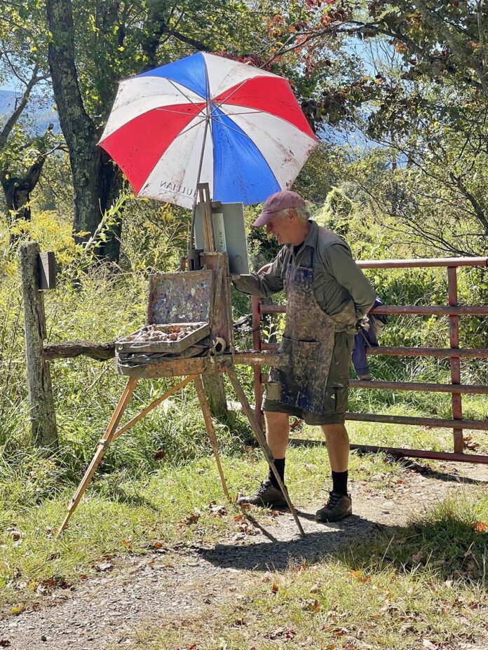 George actively painting en plein air