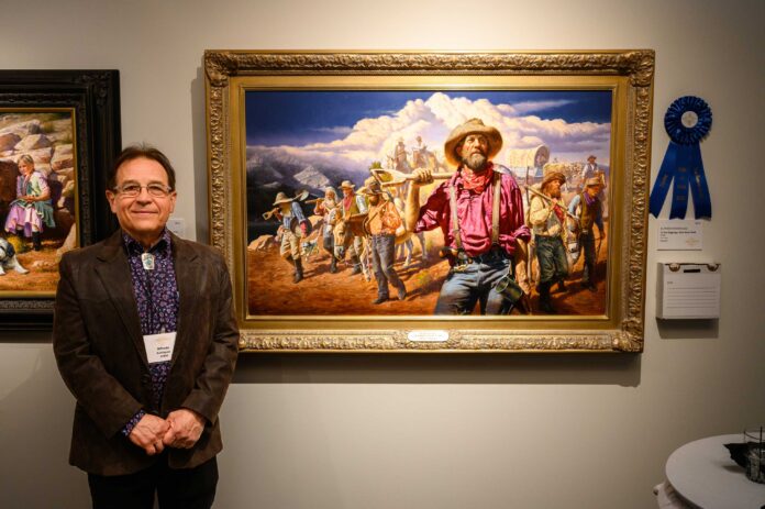 Artist Alfredo Rodriguez with his winning painting