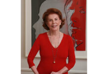 Art Patron Dies at 102 Emily Fisher Landau, photographed by Matthew Roberts, in front of Andy Warhol’s "The Shadow" (1981)