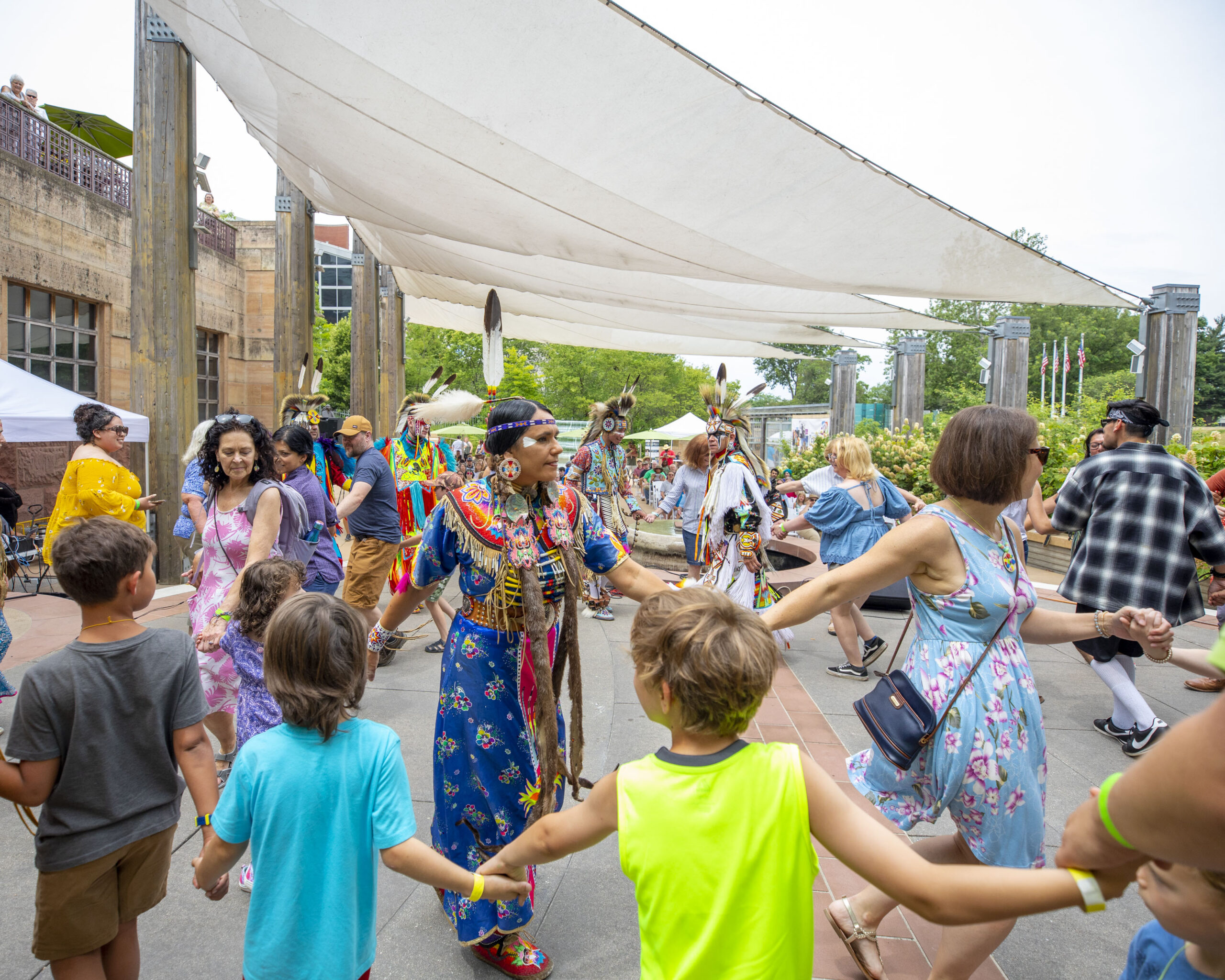 On June 24 and 25, 2023, several performers are scheduled to give music and dance performances under The Sails at the Eiteljorg Indian Market and Festival. In 2022, one of last year’s performers, the Woodland Sky Native American Dance company, got the audience involved in a dance.