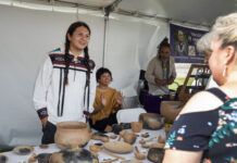 31st Annual Eiteljorg Indian Market & Festival Artist Brandon Adriano Ortiz (Taos Pueblo) discussed his pottery with a market-goer at last year’s Eiteljorg Museum Indian Market and Festival in downtown Indianapolis.