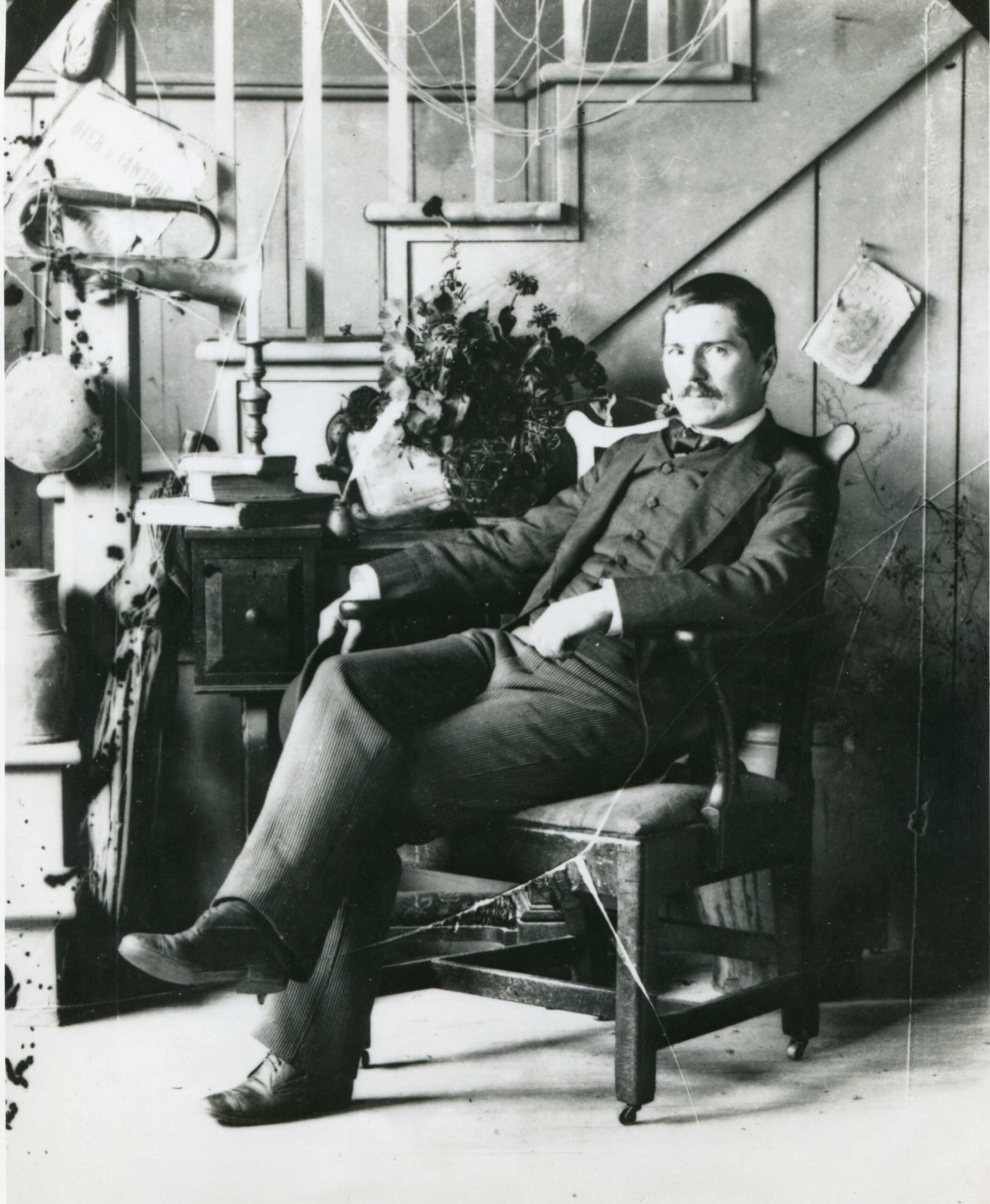 The museum owns this photograph of Peto seated in his studio, c. 1890.