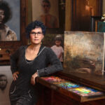 Artist Spotlight: JuliAnne Jonker artist in her studio, with her paintings