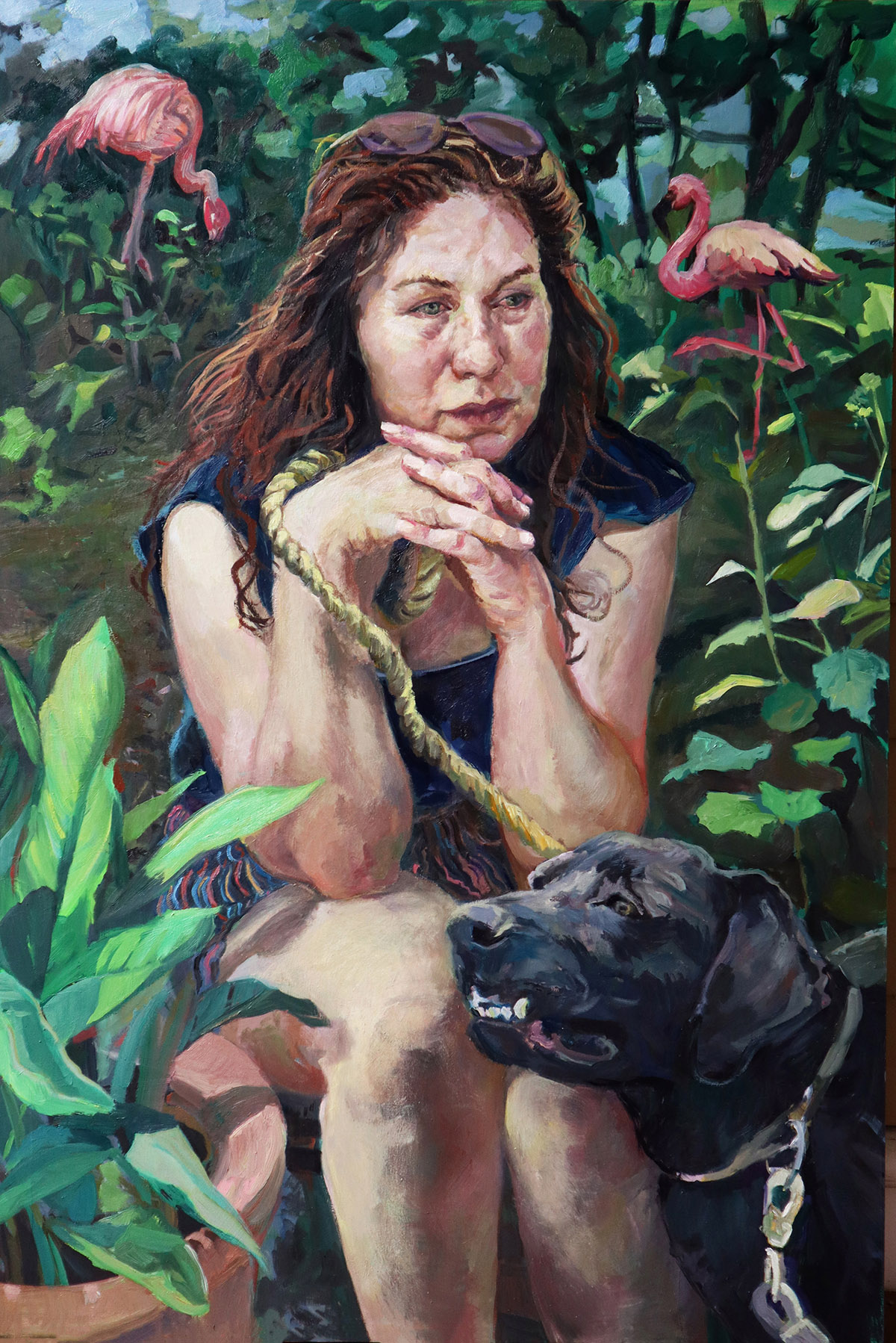 oil painting of a woman sitting, surrounded by bushes and flowers, and a black dog leaning against her