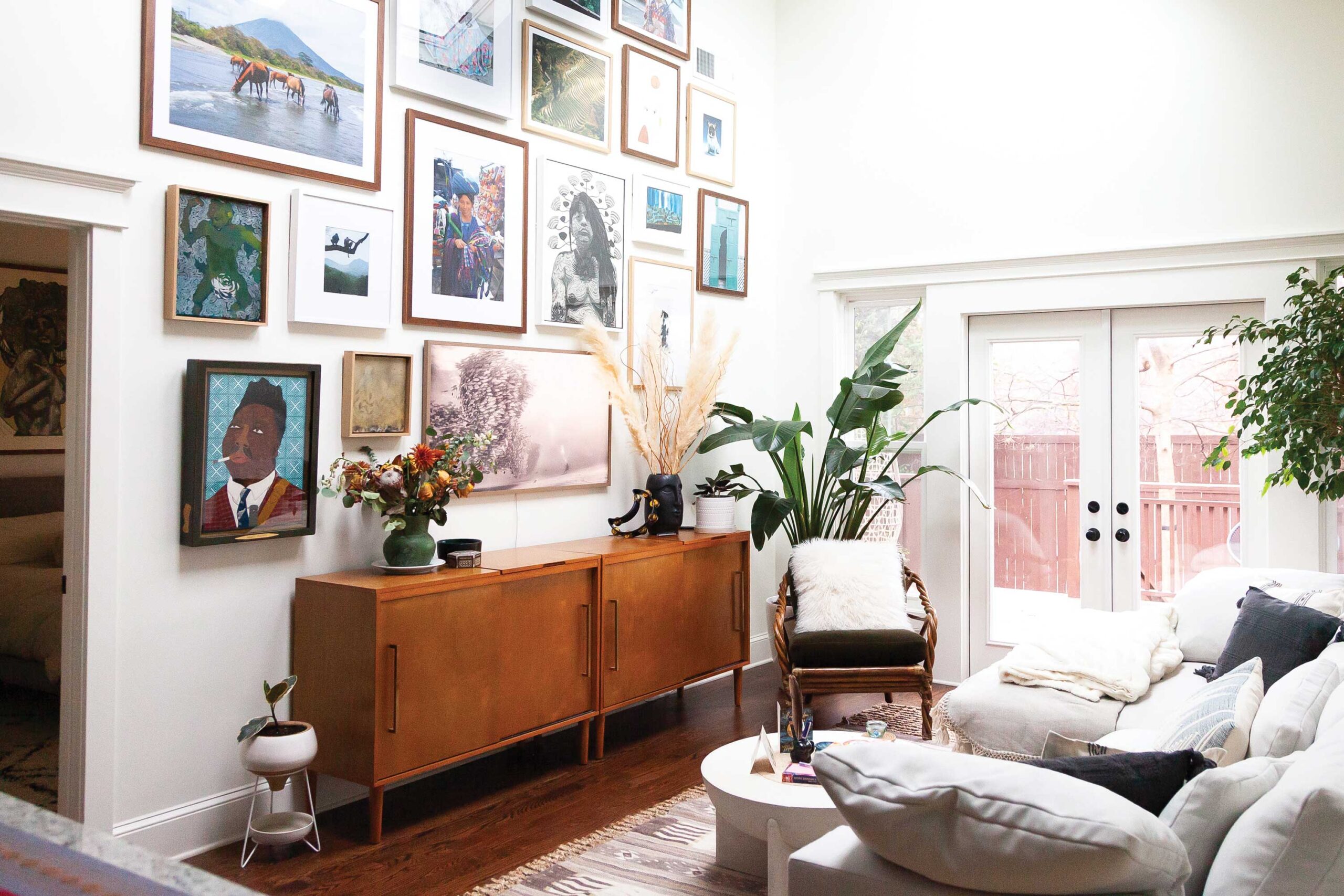 Emily Joffrion’s wall is an eclectic mix of art she has created and pieces she has collected. It’s a modern story that describes who she is. Photo: @loandbehold.atl