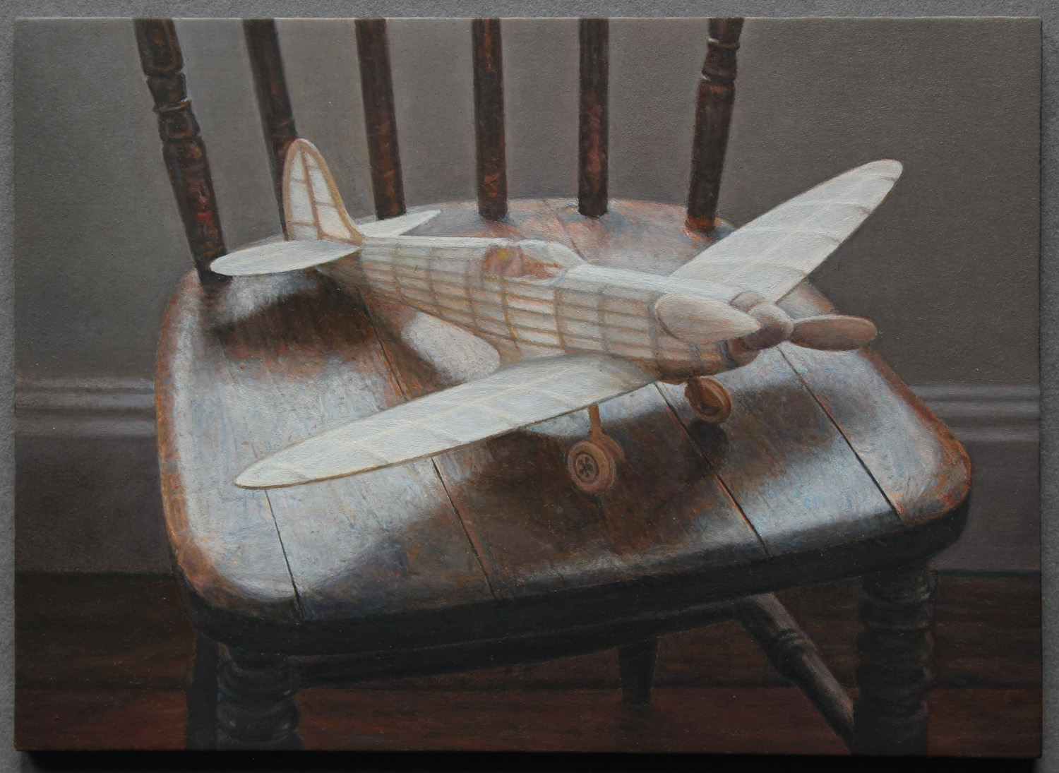 Lucy Mackenzie, "Model Aeroplane on a Chair," 2023, oil on board, 5 ½ x 4 inches