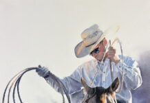 Featured Artwork: Caitlin Leline-Hatch watercolor painting of close shot of a cowboy on his horse, using his rope