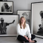 Artist Spotlight: Chelsie Murfee Chelsie sitting on the floor, posing with her drawings