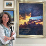 Artist Spotlight: Karen Ann Hitt, An Original Hitt Karen with her painting hanging in gallery