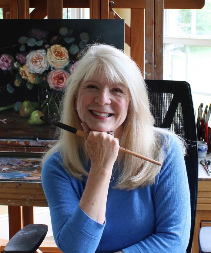 Paula B. Holtzclaw posing in her studio