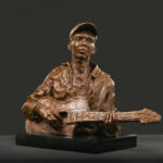 Sculptor Spotlight: Susan Wakeen and a Revelation of Character contemporary realism sculpture - Susan Wakeen, "The Guitar Player," 2020, bronze on marble base (edition of 12), 10 x 11 x 5 in., available through the artist