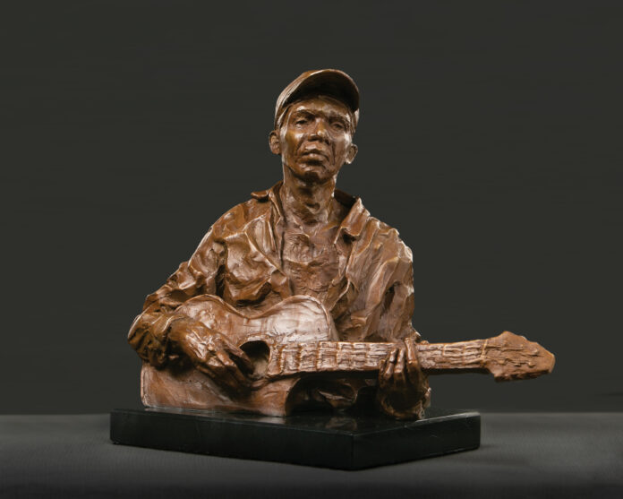 Susan Wakeen, "The Guitar Player," 2020, bronze on marble base (edition of 12), 10 x 11 x 5 in., available through the artist contemporary realism sculpture - Susan Wakeen, "The Guitar Player," 2020, bronze on marble base (edition of 12), 10 x 11 x 5 in., available through the artist