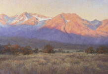 Featured Artwork: Linda Mutti red mountains behind a shadow