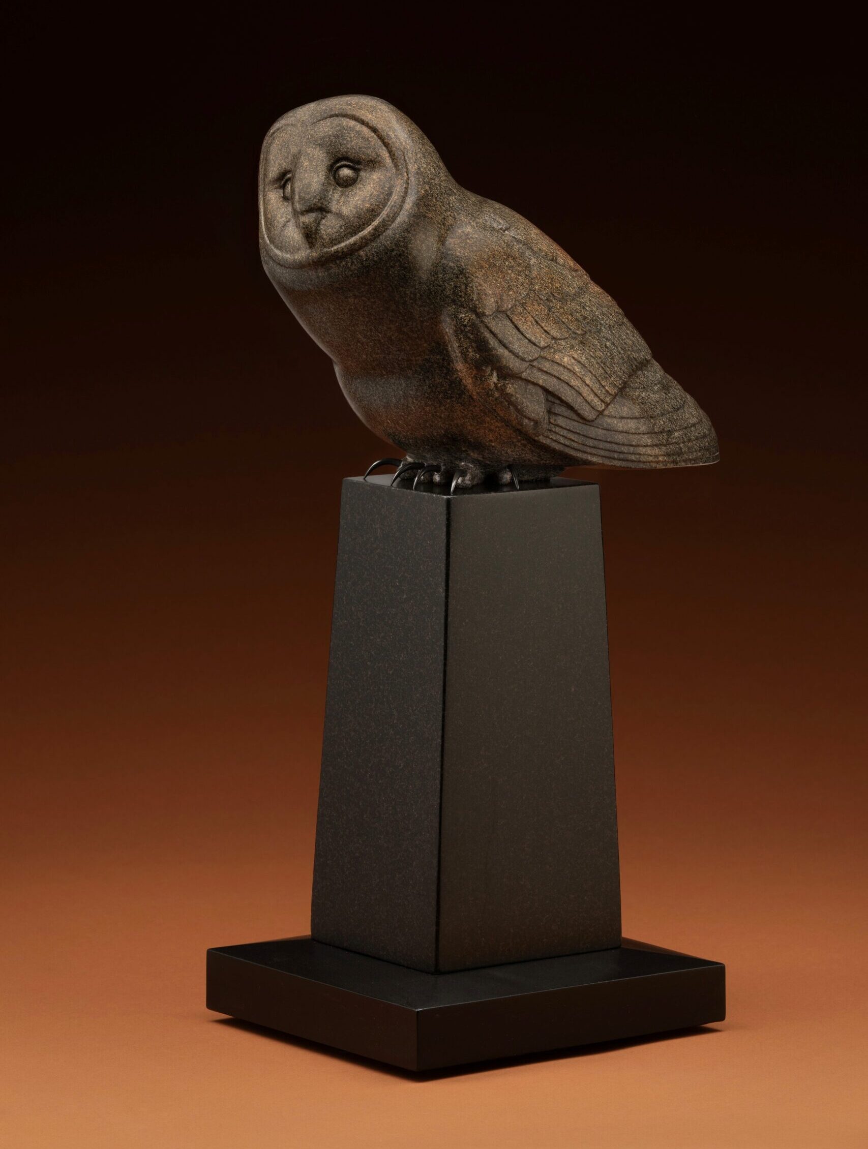 Sculpture of an owl - Steve Kestrel, "Talon Scout," Colorado granite riverstone, 24 x 9 x 15 in.