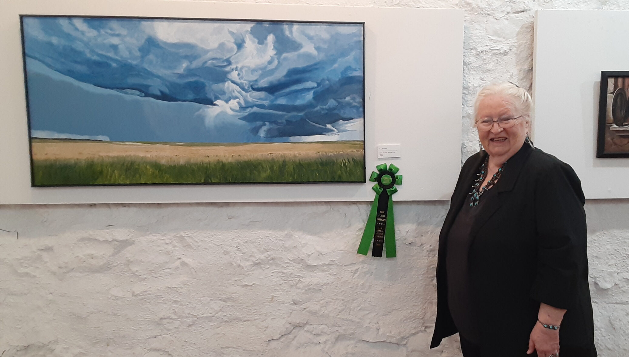 Judy McElroy, APA President, with her Best Plains Landscape painting, "Hope the Cellar Stairs are Clear."